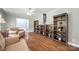 Spacious living room with hardwood floors, ample shelving, and comfortable furniture at 3378 Tanglewood Dr, Rock Hill, SC 29732