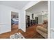 Open-concept living room with hardwood floors, built-in shelving, and natural light at 3378 Tanglewood Dr, Rock Hill, SC 29732