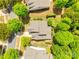 Aerial view of a beautiful neighborhood with lush trees surrounding well-maintained homes and yards at 349 Miners Cove Way, Fort Mill, SC 29708