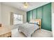 Well lit bedroom with panel accent wall and comfortable queen bed at 349 Miners Cove Way, Fort Mill, SC 29708