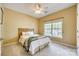 Comfortable bedroom with neutral tones, a ceiling fan and a large window offering natural light at 349 Miners Cove Way, Fort Mill, SC 29708