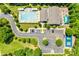 Aerial view of a community pool, clubhouse, playground, tennis courts, and parking area surrounded by trees at 349 Miners Cove Way, Fort Mill, SC 29708