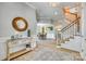 Open foyer showcases a staircase, wood floors, and access to the dining area for seamless flow at 349 Miners Cove Way, Fort Mill, SC 29708