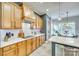 Spacious kitchen with stainless steel appliances, quartz countertops, and a breakfast nook with natural light at 349 Miners Cove Way, Fort Mill, SC 29708