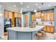 Modern kitchen with a large island, stainless steel appliances, and beautiful custom cabinets at 349 Miners Cove Way, Fort Mill, SC 29708