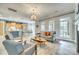 Open-concept living room with a fireplace, kitchen and dining area at 349 Miners Cove Way, Fort Mill, SC 29708