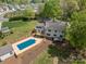 Aerial view of a beautiful backyard with a pool surrounded by lush landscaping at 3755 11Th Ne St, Hickory, NC 28601