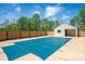 Expansive yard features pool with safety cover, privacy fence, and detached garage at 3755 11Th Ne St, Hickory, NC 28601
