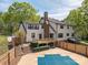Two-story home featuring a wood deck, a fenced yard, and a swimming pool partially covered at 3755 11Th Ne St, Hickory, NC 28601
