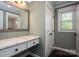 Bathroom vanity with granite countertop and a large mirror at 3755 11Th Ne St, Hickory, NC 28601