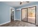 Bedroom with access to porch; adjoins bathroom featuring pedestal sink and mirror at 3755 11Th Ne St, Hickory, NC 28601