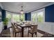 Elegant dining room featuring a modern chandelier and large windows offering plenty of natural light at 3755 11Th Ne St, Hickory, NC 28601