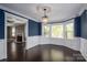 Elegant dining room with wainscoting, stylish chandelier, and bay windows at 3755 11Th Ne St, Hickory, NC 28601
