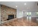 Basement living area featuring a stone fireplace and walkout access at 3755 11Th Ne St, Hickory, NC 28601
