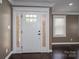 Elegant white front door with sidelights and transom window, leading into a beautifully finished home at 3755 11Th Ne St, Hickory, NC 28601
