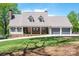 Charming home with brick accents, dormer windows, two-car garage, and a well-manicured lawn at 3755 11Th Ne St, Hickory, NC 28601