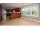 Spacious eat-in kitchen with stainless steel appliances, wood cabinets, a tile backsplash, and plenty of natural light at 3755 11Th Ne St, Hickory, NC 28601