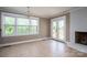 Living Room with a fireplace, French doors to a deck, and large windows providing plenty of natural light at 3755 11Th Ne St, Hickory, NC 28601