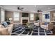 Bright, staged living room showcasing a marble fireplace and hardwood flooring at 3755 11Th Ne St, Hickory, NC 28601