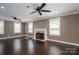 Living room with hardwood flooring, neutral tones, and a cozy fireplace at 3755 11Th Ne St, Hickory, NC 28601