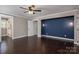 Spacious main bedroom with hardwood floors, tray ceilings, and recessed lighting at 3755 11Th Ne St, Hickory, NC 28601