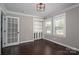 Bright office space with built-in shelving, stylish French door, and ample natural light at 3755 11Th Ne St, Hickory, NC 28601