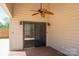 Covered porch with sliding glass doors, ceiling fan, and wood flooring at 3755 11Th Ne St, Hickory, NC 28601