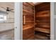 Interior wooden sauna with a bench; kitchen and white cabinets partially visible in the background at 3755 11Th Ne St, Hickory, NC 28601