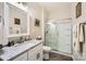 Bright bathroom featuring a white vanity with granite countertop and a glass-enclosed shower at 3939 Archer Notch Ln, Huntersville, NC 28078