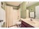 Bathroom with a shower and tub combo, vanity with a sink, and neutral color scheme at 3939 Archer Notch Ln, Huntersville, NC 28078