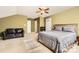 Bedroom featuring a comfortable bed, black leather sofa, and plenty of natural light at 3939 Archer Notch Ln, Huntersville, NC 28078
