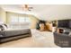 Spacious bedroom with carpet, ceiling fan, and natural light from a window at 3939 Archer Notch Ln, Huntersville, NC 28078