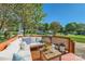 Relaxing outdoor deck with comfortable seating and a view of the surrounding yard at 3939 Archer Notch Ln, Huntersville, NC 28078