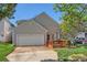Charming home with a one-car garage, a cozy front deck, and well-maintained landscaping at 3939 Archer Notch Ln, Huntersville, NC 28078