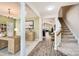 Inviting foyer showcasing an open floor plan with hardwood floors and staircase, blending style and functionality at 3939 Archer Notch Ln, Huntersville, NC 28078