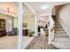 Inviting foyer showcasing an open floor plan with hardwood floors and staircase, blending style and functionality at 3939 Archer Notch Ln, Huntersville, NC 28078