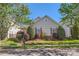 Quaint home featuring manicured landscaping and a well-maintained lawn, creating curb appeal at 3939 Archer Notch Ln, Huntersville, NC 28078