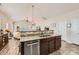 An open kitchen includes stainless steel appliances, a granite countertop, and lots of storage space at 3939 Archer Notch Ln, Huntersville, NC 28078