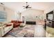 Spacious living room with vaulted ceiling, cozy furniture, and ample natural light from large windows at 3939 Archer Notch Ln, Huntersville, NC 28078