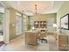 Inviting home office featuring natural light from a large window, custom shelves and desk at 3939 Archer Notch Ln, Huntersville, NC 28078