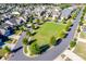Planned community with tree-lined sidewalks and streets and neighborhood lawns and common area at 4083 Home Grown Way, Clover, SC 29710