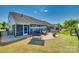 Spacious backyard with brick patio, grill area, and swing set, perfect for outdoor entertaining at 4083 Home Grown Way, Clover, SC 29710