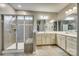 Bright bathroom featuring a glass shower and double vanity sinks with neutral countertops at 4083 Home Grown Way, Clover, SC 29710