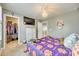 Bedroom showcasing a plush bed, dresser, walk-in closet, and mounted TV at 4083 Home Grown Way, Clover, SC 29710
