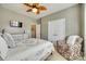Bedroom featuring a comfortable chair, white dresser, and neutral color scheme at 4083 Home Grown Way, Clover, SC 29710