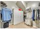 Walk-in closet with a white cabinet, metal racks, and a carpeted floor at 4083 Home Grown Way, Clover, SC 29710