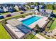 Aerial view of the community pool, surrounded by lounge chairs and lush landscaping at 4083 Home Grown Way, Clover, SC 29710