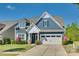Charming two-story home with a well-manicured lawn, attached garage, and beautiful curb appeal at 4083 Home Grown Way, Clover, SC 29710