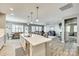 Open-concept kitchen featuring a large island with seating, seamlessly connecting to the living area at 4083 Home Grown Way, Clover, SC 29710