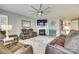 Comfortable living room features brown leather reclining furniture, a fireplace, and an oversized ceiling fan at 4083 Home Grown Way, Clover, SC 29710
